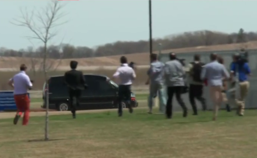 "Guy in the orange pants is pretty quick!" remarked MSNBC host Thomas Roberts, as media run after Hillary Clinton's "Scooby" van in Iowa.