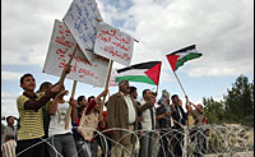 Palestinians protest from inside Homesh against the return of Jewish settlers in November 2008.