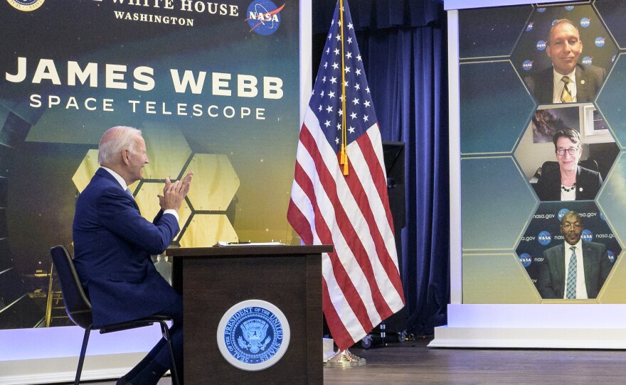 President Biden previews the first full-color image from NASA's James Webb Space Telescope from the White House on Monday, along with three NASA officials including Gregory Robinson (bottom).