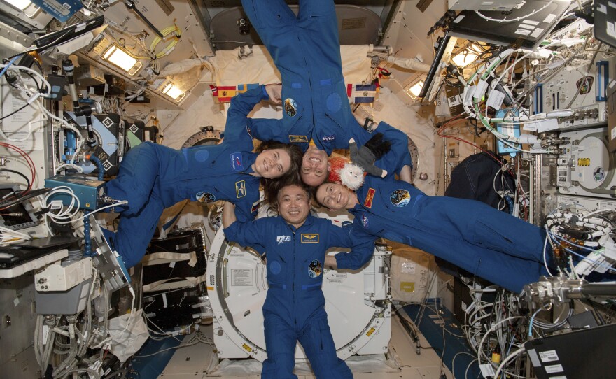 Expedition 68 Flight Engineers, pictured clockwise from left, Anna Kikina of Roscosmos, Josh Cassada and Nicole Mann from NASA, and Koichi Wakata of JAXA (Japan Aerospace Exploration Agency) gather for a portrait inside the International Space Station's Kibo laboratory module on March 1.