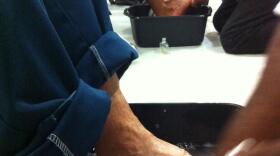 Homeless men at the San Diego Rescue Mission receive a foot-bath from volunteers with the Samaritan's Feet Project.