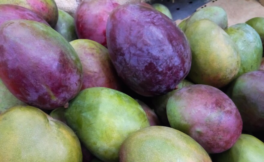 Fresh mangoes at a market stall in Caracas, Venezuela.