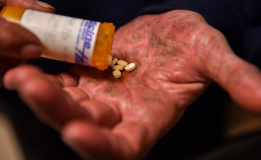 Greg Miller shows the Suboxone medication in 2016 that he has taken daily for his addiction to painkillers.