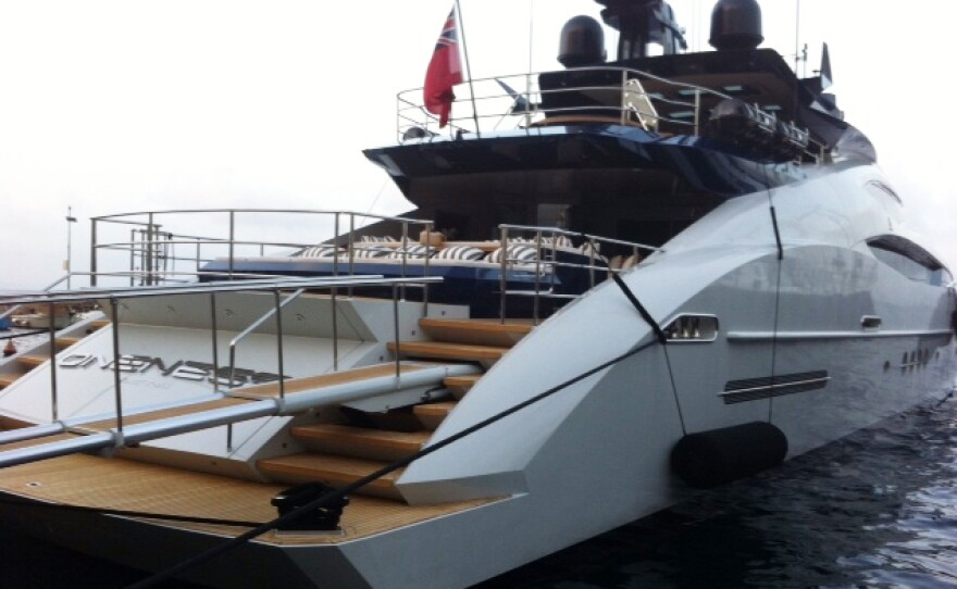 A foreign yacht is berthed at Porto Santo Stefano. Italian police have been raiding ports to check if yacht owners have been paying enough taxes.