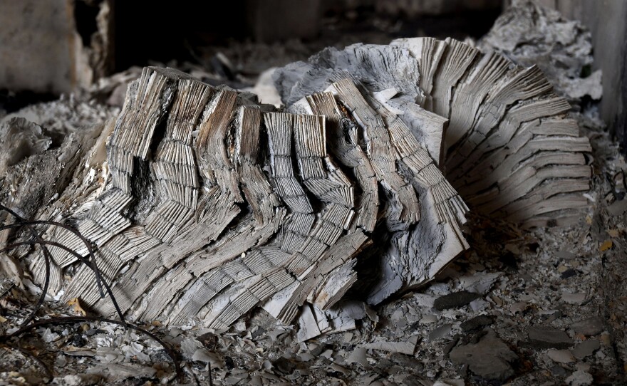 Books unread. An accordion of ash.