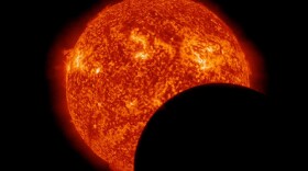 This photo from NASA’s Solar Dynamics Observatory on March 11, 2013, at 8 a.m. EDT, shows the moon crossing in front of the sun.