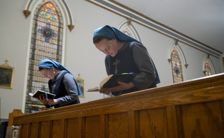 Sister Danielle Lussier and Sister Theresa Alethia sing morning prayers in the chapel next to their home in Mt. Sterling, Ky., in April.