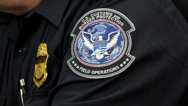 A customs agent wears a patch for the U.S. Customs and Border Protection agency, Friday, Oct. 27, 2017. 