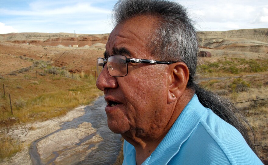 Wes Martel, vice chairman for the Eastern Shoshone Business Council, stands near a murky gray stream full of oil field wastewater. He's concerned about the effects the wastewater has on wildlife, water quality and, since cows drink it, he wonders: "What's in your steak?"