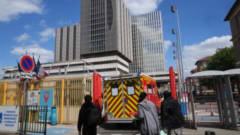 An ambulance enters the Bichat Hospital where a woman who tested positive for hantavirus remains in intensive care, in Paris, Tuesday, May 12, 2026.