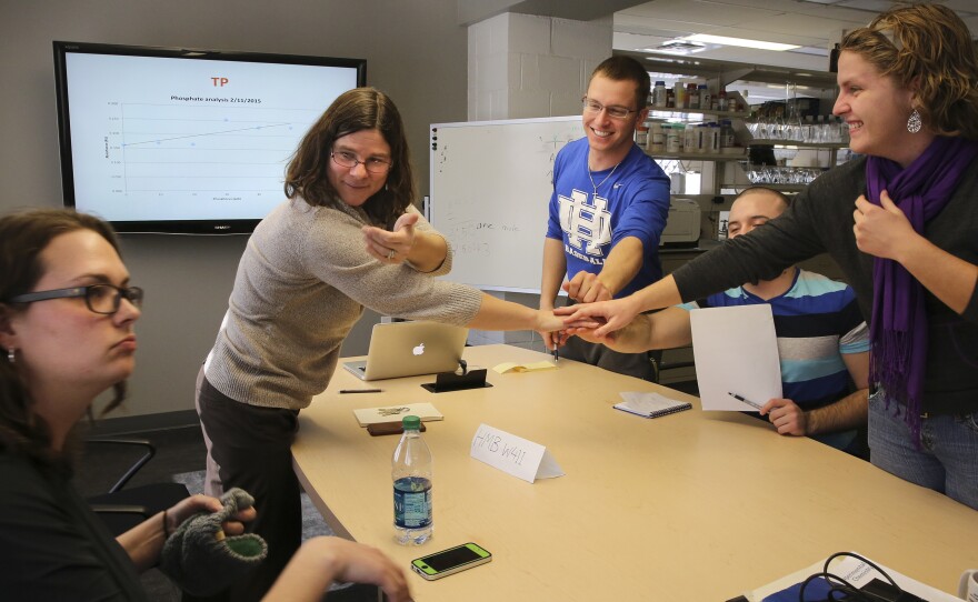 Solomon ends her biology lab with all hands in.
