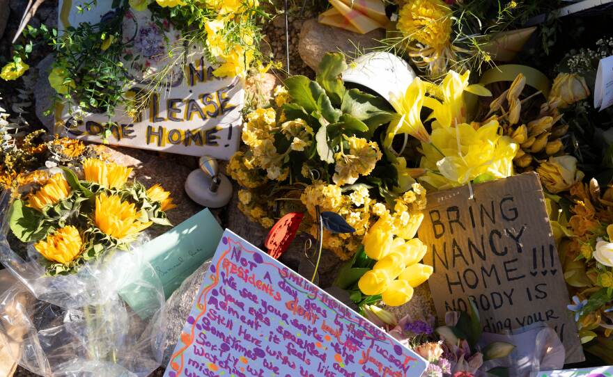 Yellow flowers and handwritten notes calling for the return of Nancy Guthrie sit outside the house of the 84-year-old mother of Today show co-host Savannah Guthrie, in Tucson, Ariz. Savannah Guthrie is speaking about her mother in an emotional two-part interview.