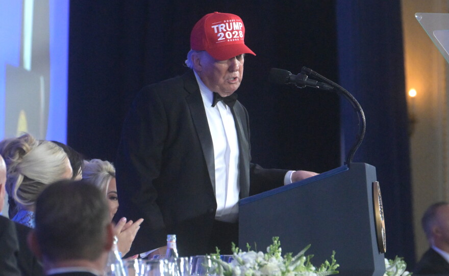 President Donald Trump speaks at the White House Correspondents' Association dinner at the Waldorf Astoria in Washington DC on Friday.