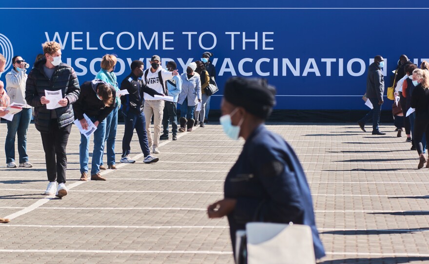 Residents wait to register at a mass vaccination site in Johannesburg on July 8.