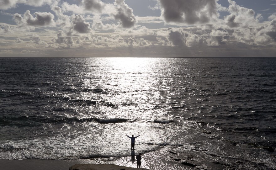 A man enjoyed the beach in San Diego on Thursday before Californians were told to stay at home to interrupt the spread of the coronavirus.