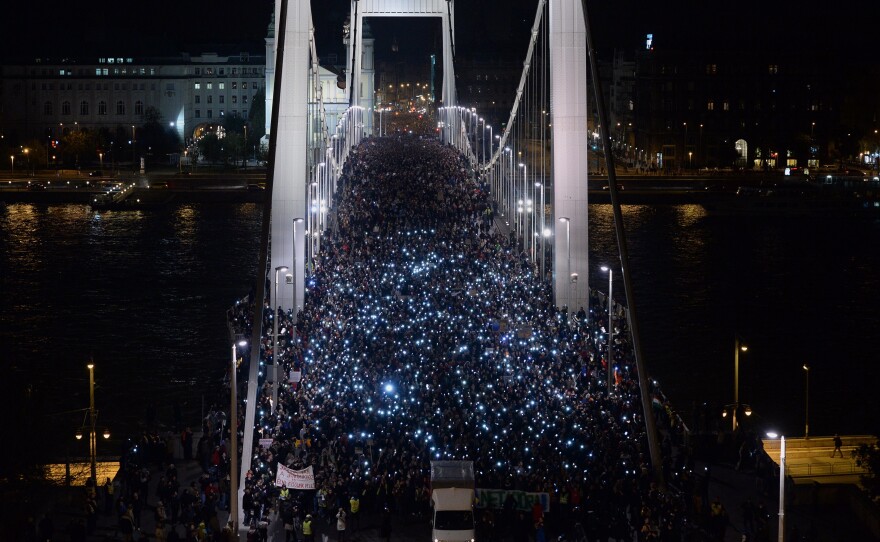 Thousands of participants march across the Elisabeth bridge during a rally against the government's plan to tax Internet usage.