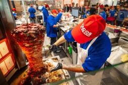 Cooks in the kitchen at Tijuana’s Legendary Tacos El Franc