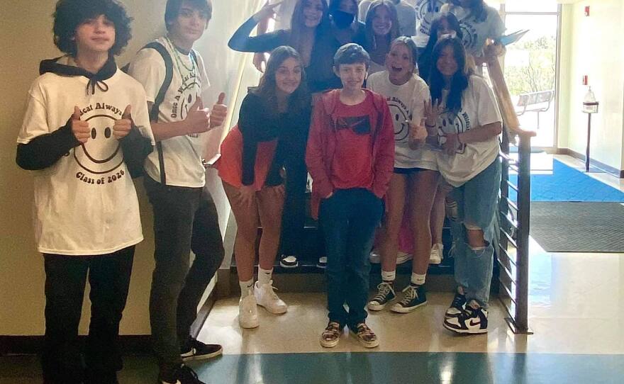 Students posing with Brody Ridder at his school.