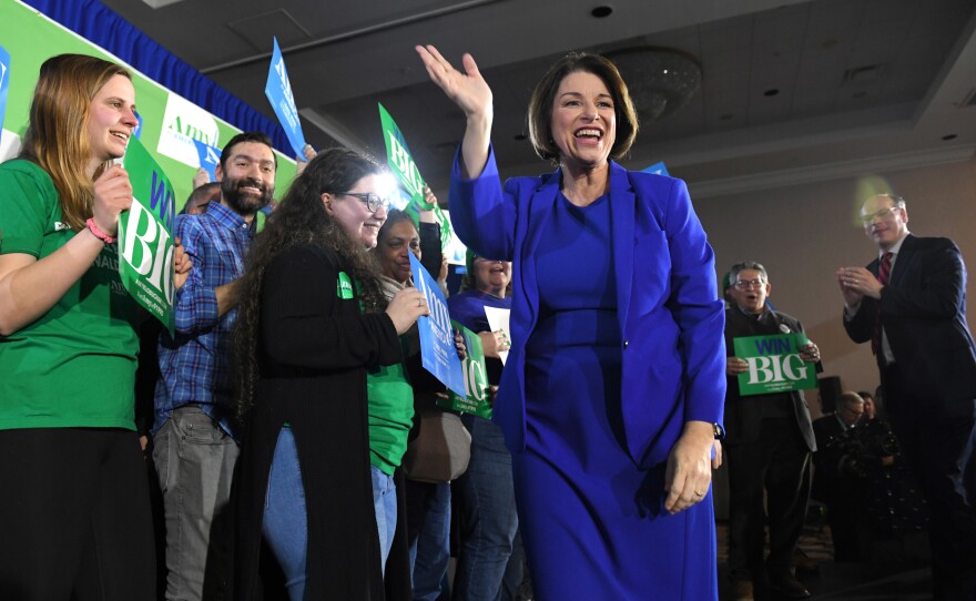 Amy Klobuchar waves to supporters at her New Hampshire primary night rally. She appears to have found a lane for a hopeful message between Sanders and the rest of the pack.