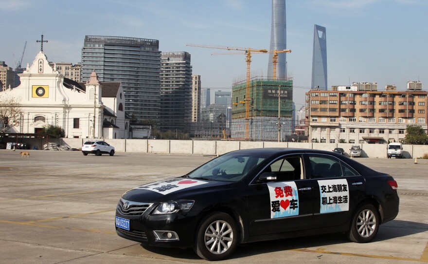 NPR Shanghai correspondent Frank Langfitt put signs on his Toyota Camry saying he would give passengers free rides around Shanghai in exchange for their stories about the bustling city. He's found plenty of takers.