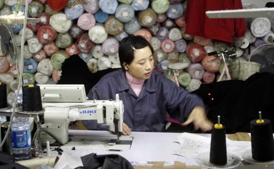 A Chinese employee works in a textile firm in the Macrolotto area in Prato, the biggest textile district in Europe, in 2005. The town has become home to the largest concentration of Chinese residents in Europe — many of whom are not legal.