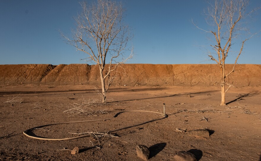 Sections of a broken irrigation system in what was once a thriving community farm backed by the Great Green Wall initiative in Kourtimale, Djibouti. The farm's irrigation system failed, and the land reverted to desert.