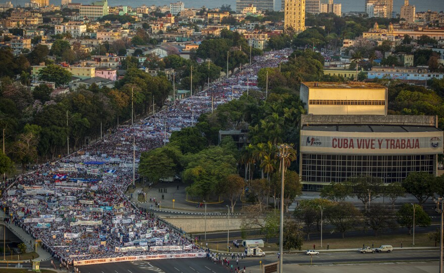 Thousands file through an avenue during a May Day march to Revolution Square in Havana, Cuba, on Sunday.