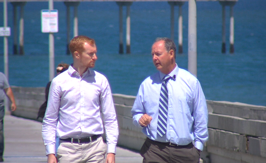 San Diego mayoral candidate Ed Harris, right, speaks to KPBS metro reporter Andrew Bowen at the Ocean Beach Pier, May 2, 2016.