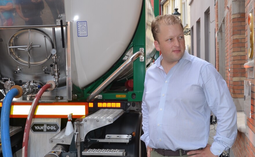 De Halve Maan brewery director Xavier Vanneste looks on as the last beer tanker prepares for its trip. The brewery will now transport beer using a pipeline.