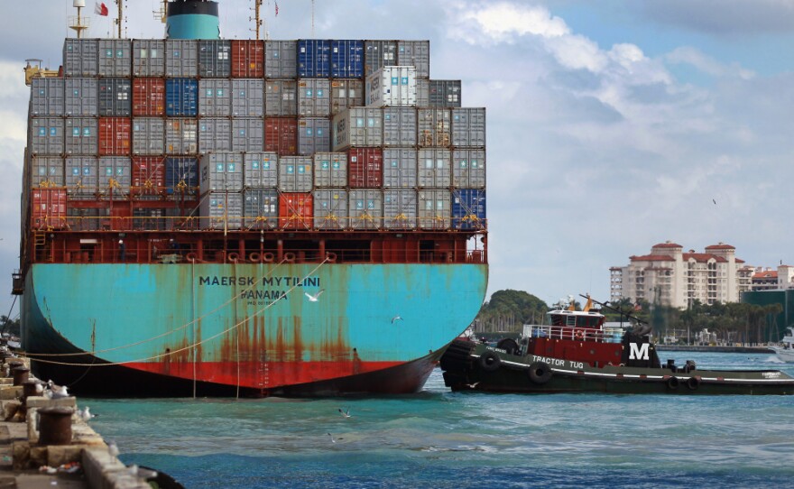 A container ship prepares to leave the Port of Miami in 2010. Plans are under way to deepen the port to 50 feet to attract bigger ships coming from the Panama Canal, but they've recently been put on hold after environmental groups filed a petition.
