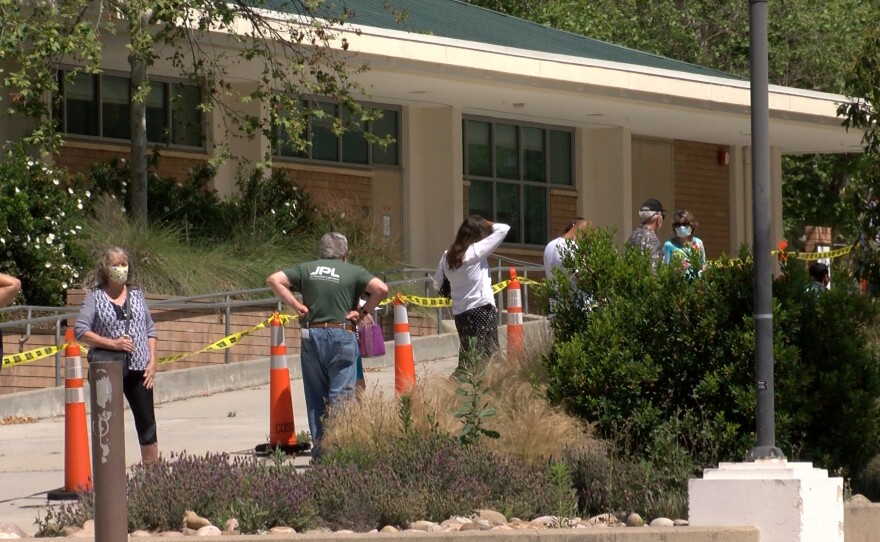 People line up for a COVID-19 test in El Cajon at Grossmont College, May 5, 2020.