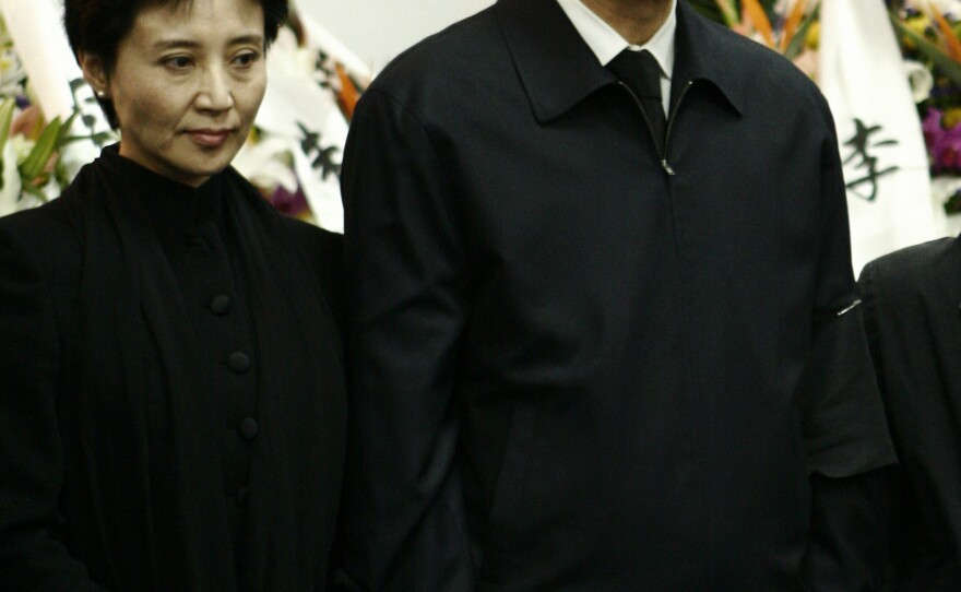 Gu Kailai, the wife of disgraced Chinese politician Bo Xilai, will stand trial on charges related to the murder of British businessman Neil Heywood. Here, the couple is shown in 2007 attending Bo's father's funeral.