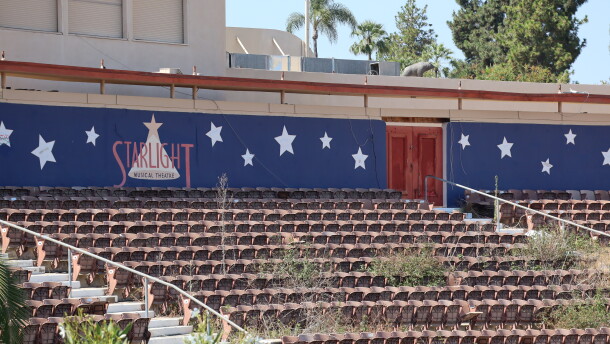 Plants spring up among the seats at the shuttered Starlight Bowl, an open-air amphitheater in San Diego's Balboa Park.