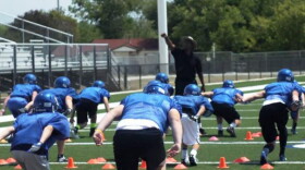 Coach Bobby Hosea teaching tackling.