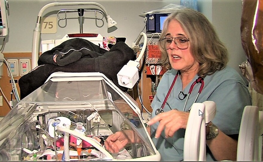 Neonatologist Nancy Wight examines a premature infant in the neonatal intensive care unit at Sharp Mary Birch Hospital for Women, Nov. 16, 2016.