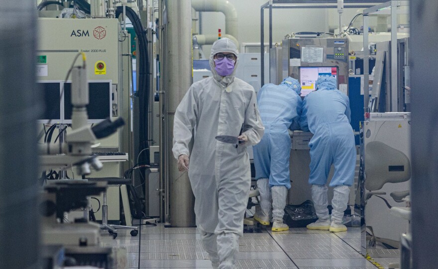 A student wears cleanroom suit conducts a research inside the clean room of Taiwan Semiconductor Research Institution during a press semiconductor tour at Hsinchu Science Park on September 16, 2022 in Hsinchu, Taiwan.