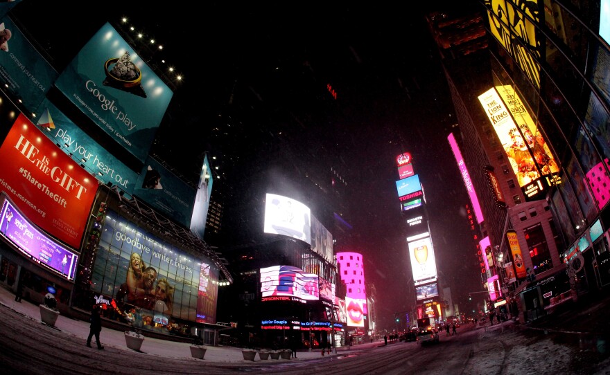 Times Square is mostly empty following road closures on Tuesday in preparation for what was predicted to be a major winter storm.