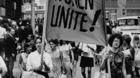 Signs saying “Women Unite” carried by women supporters during a Women’s Liberation demonstration on Fifth Avenue and on Wall Street, 1970.
