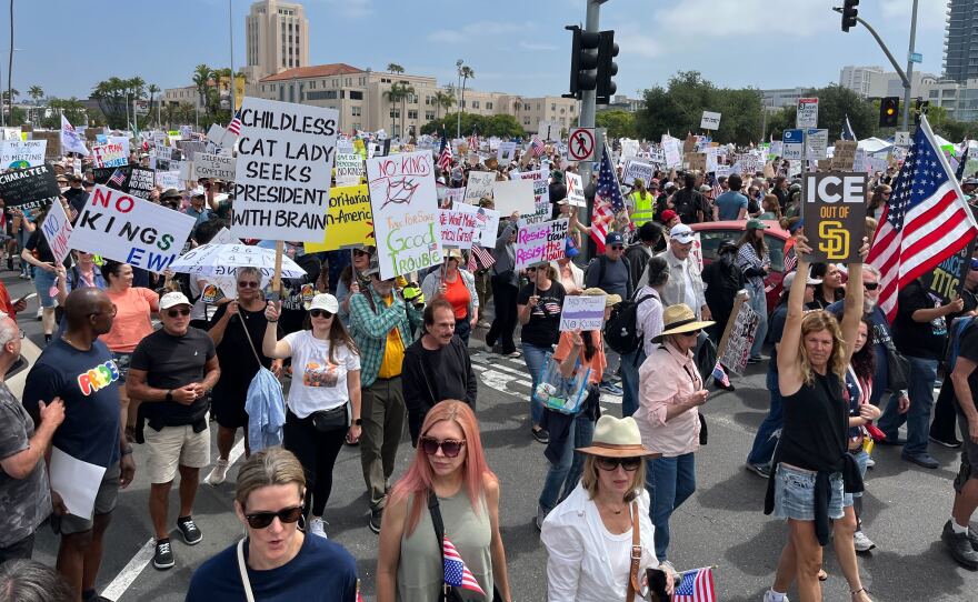 Protesters march south on Harbor Drive in downtown San Diego on June 14, 2025. The protest — which organizers are calling "No Kings" Day is part of a nationwide movement to rally against President Donald Trump's policies.