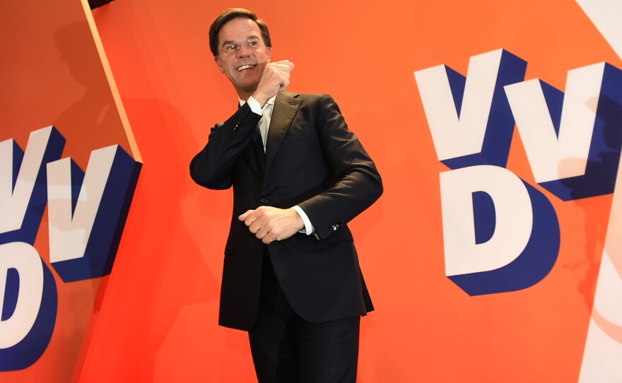 The Netherlands' Prime Minister Mark Rutte celebrates a big win by his VVD party in The Hague. Wednesday's vote will force far-right politician Geert Wilders into second place along with two other parties, the Christian Democratic Appeal and the Democracy party D66, exit polls predict.