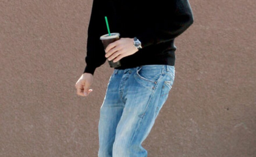 Here Kutcher practices his nerd walk off camera.