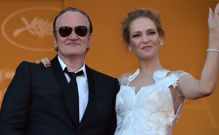 Director Quentin Tarantino and actress Uma Thurman pose at the Cannes Film Festival in 2014. He acknowledges convincing her to do a dangerous driving scene which ended in a crash.