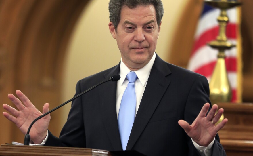 Kansas Gov. Sam Brownback speaks to the state Legislature in Topeka. The state Supreme Court rejected some education funding changes enacted by lawmakers earlier this year and threatened to order the state's public schools closed if inequality is not corrected.