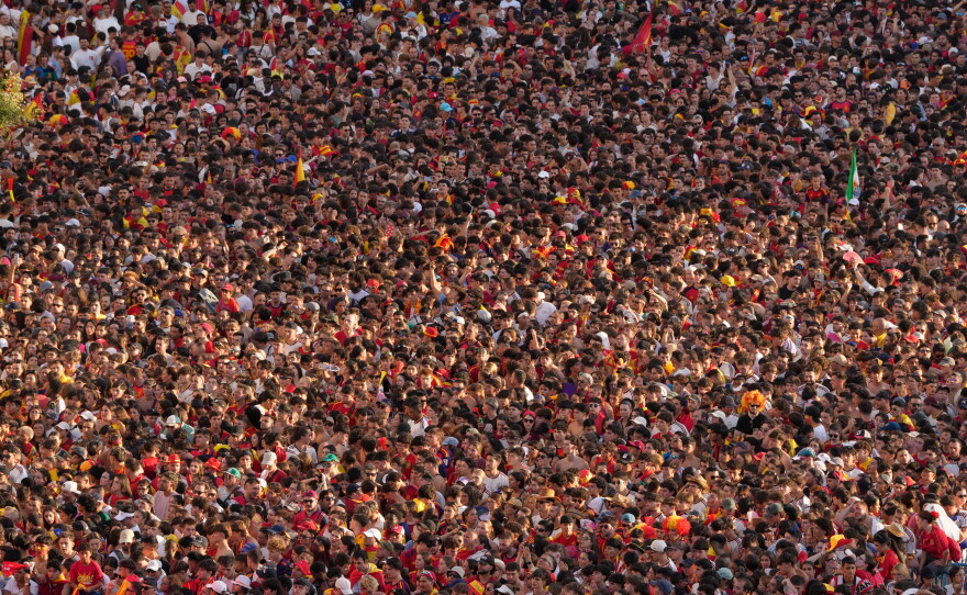 Fans crowd together as they wait for the arrival of players from Spain's national soccer team in Madrid on Monday, July 20, 2026, after Spain defeated Argentina in the World Cup final in East Rutherford, N.J., near New York.