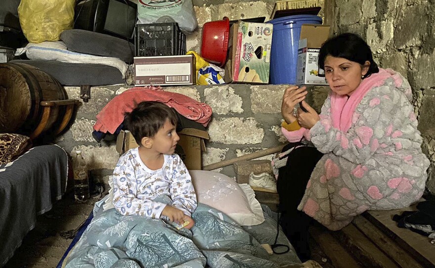 Children take shelter during shelling in Nagorno-Karabakh, as Azerbaijan forces fired artillery at Armenian positions in the breakaway enclave.