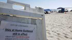 A sign at Coronado beach on July 12 telling residents the city's stay-at-home order is still in effect.