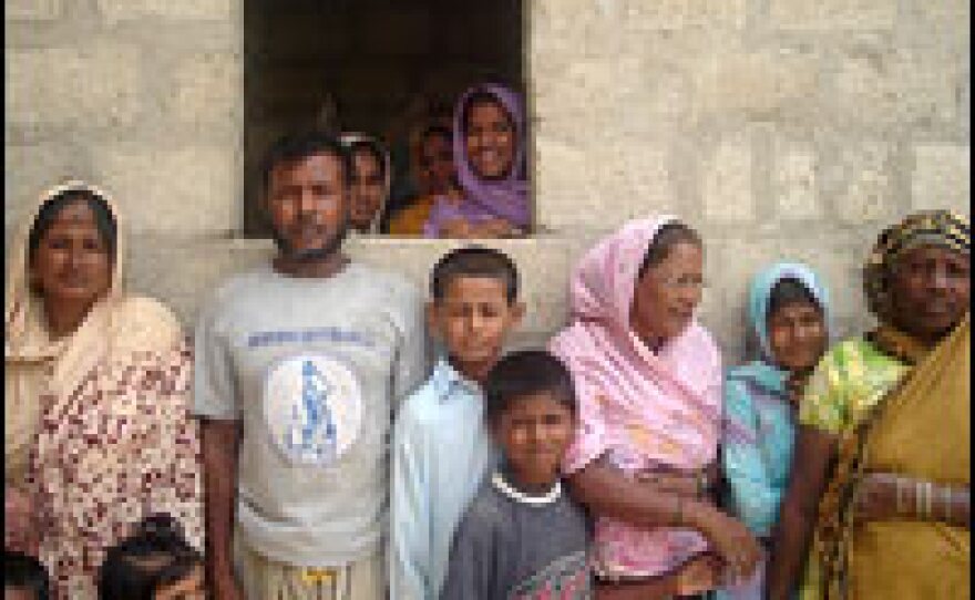 These two families, with 16 children combined, live on the edge of Karachi in an area where illegal houses are common.
