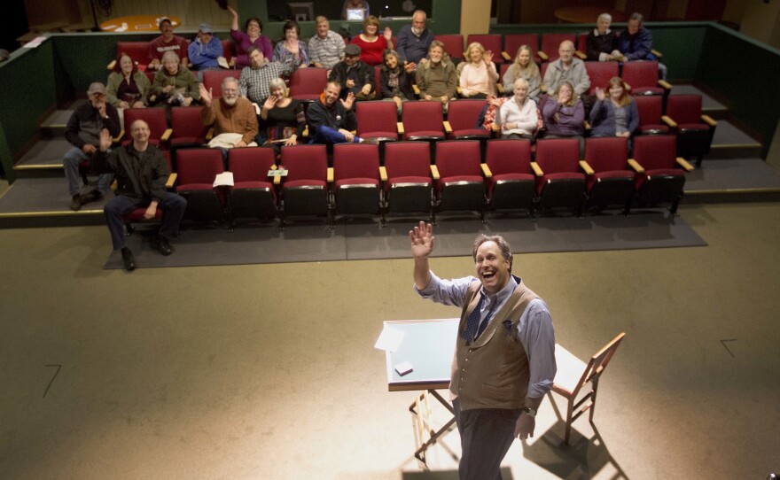 Magician Andrew Pinard waves during his performance at the Hatbox Theater in Concord, N.H. The theater took over the location of a closed clothing store at the Steeplegate Mall.