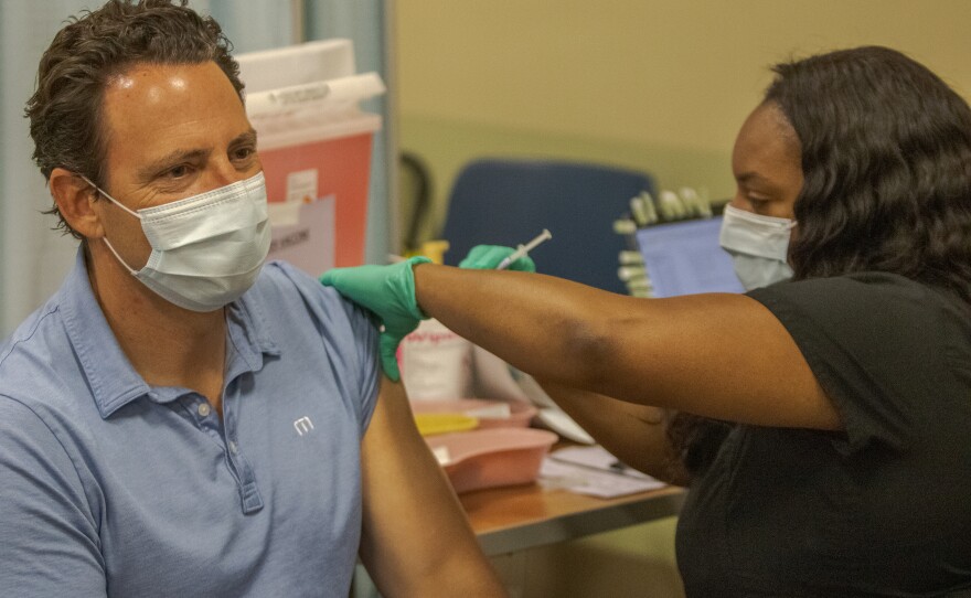San Diego County Supervisor Nathan Fletcher receives a COVID-19 vaccine from the Veterans Administration in San Diego, Calif. April 15, 2021.