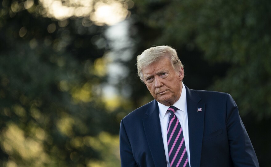 President Trump, pictured on the South Lawn of the White House on Tuesday, signed an executive order on certain training about race for federal contractors, expanding an earlier ban on federal employees.